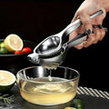 Citruspresser Af Rustfrit Stål Med Ergonomisk Haandtag Og Pulpfri Saft