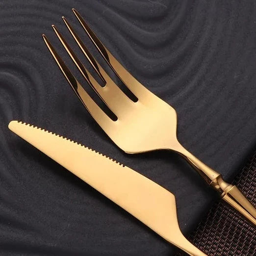 Bestiksæt i rustfrit stål med guldfarvede detaljer