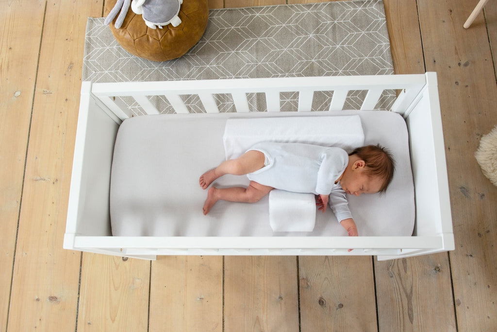 Anti‑Roll Wedgepude til Baby